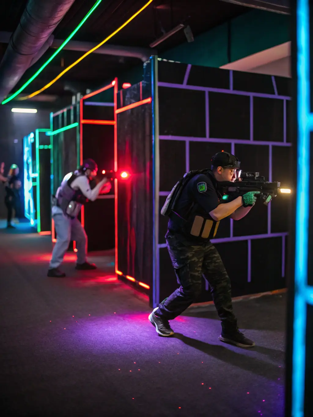 An action-packed image of players participating in a laser tag game, running and strategizing in a darkened arena with neon lights.